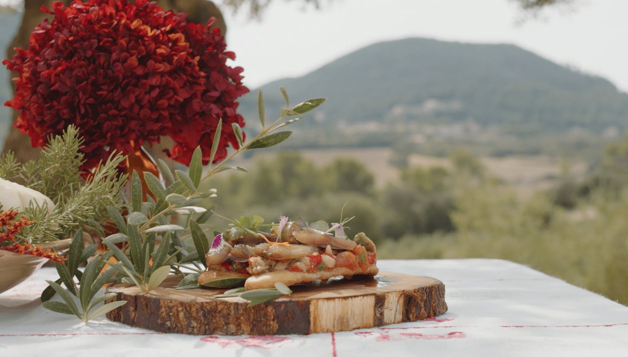 Olive oil coca with roasted vegetables and smoked sardines